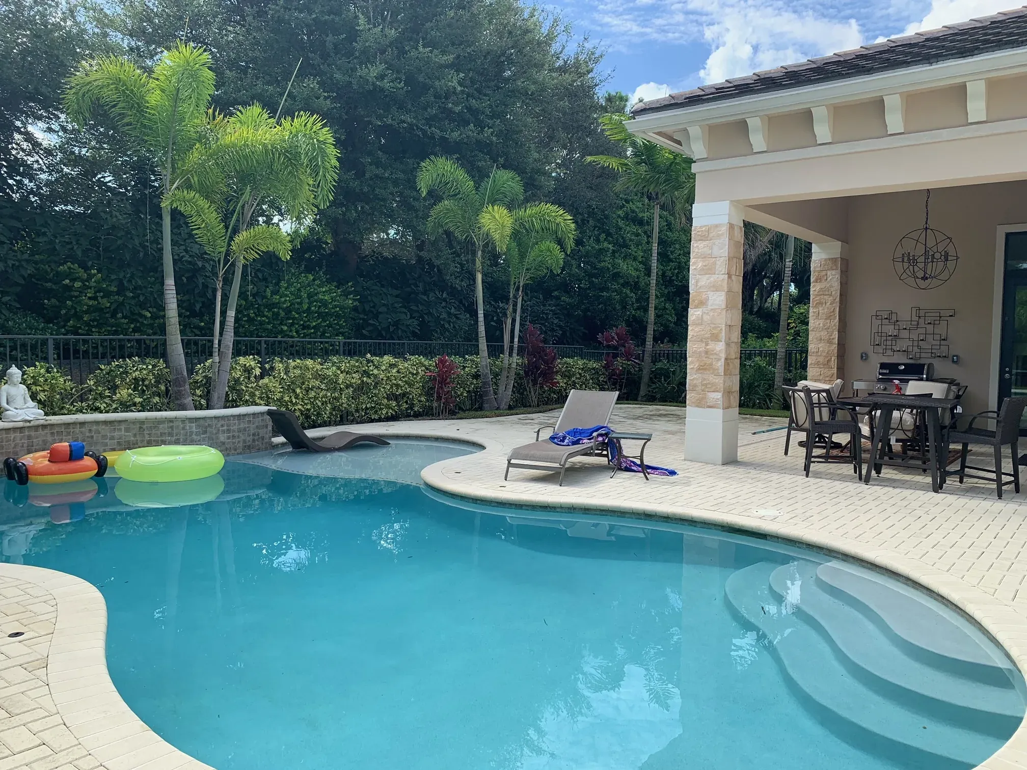 South Florida backyard pool protected by Mosquito Shield barrier spray