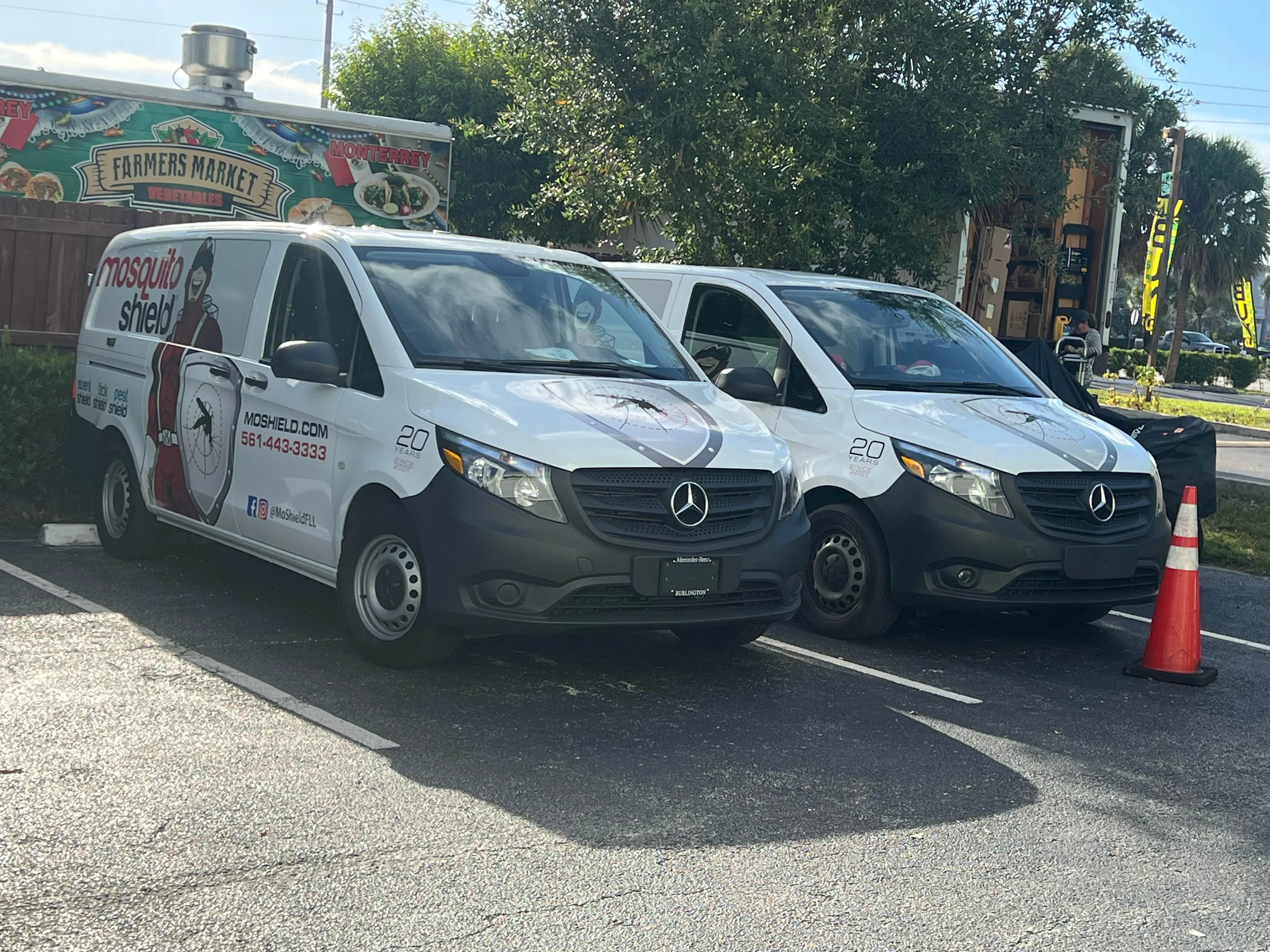 Mosquito Shield vans serving an HOA community in South Florida