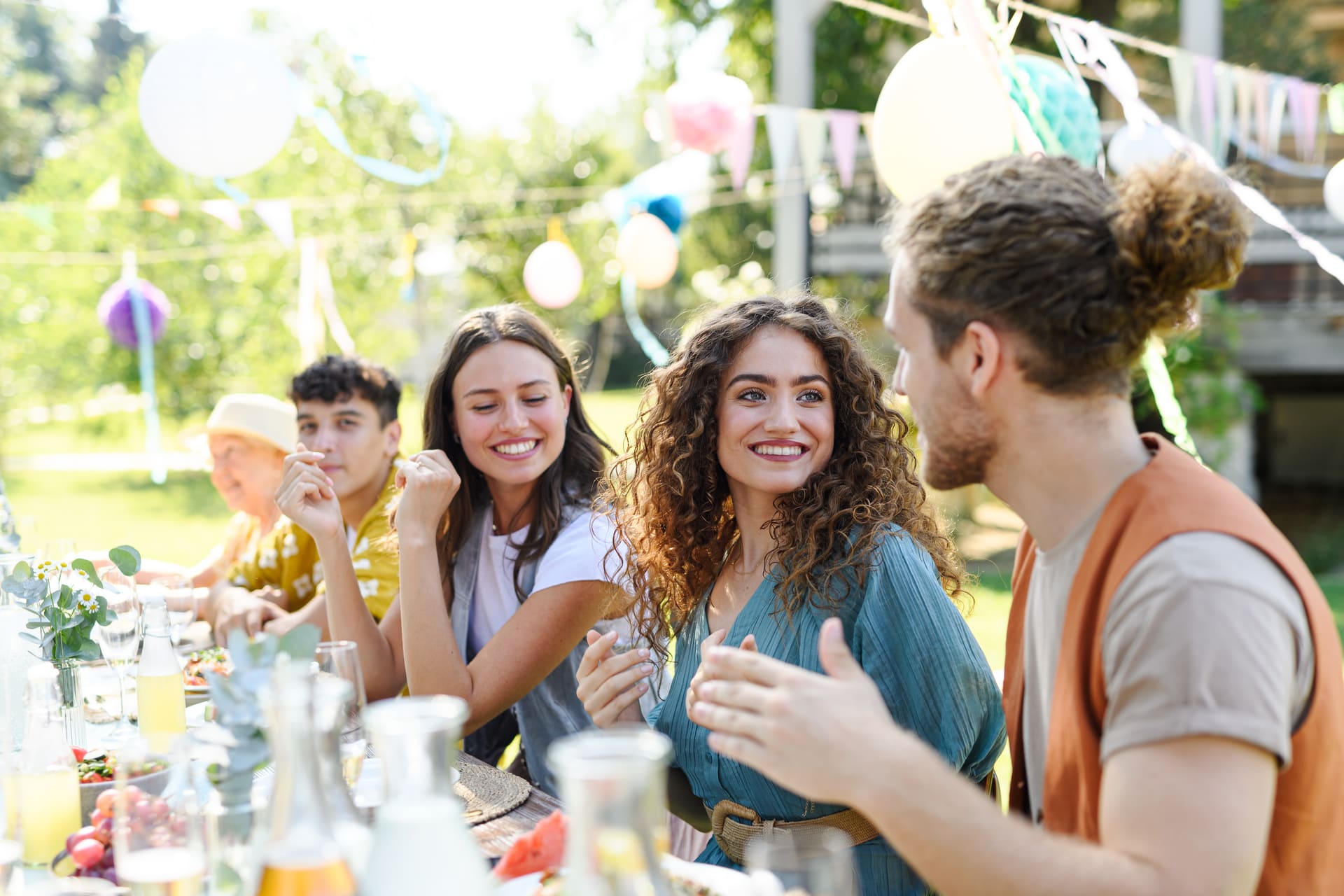 Outdoor celebration in South Florida protected by Mosquito Shield Event Shield treatment — guests enjoying a gathering without mosquitoes